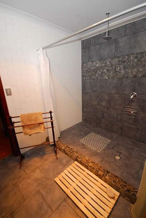 Large shower with large shower head.